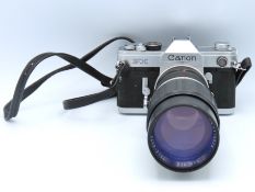 A Canon FX 35mm film camera with Hanimex Tele-Auto