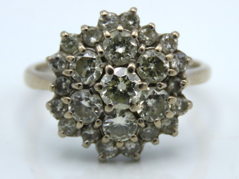 An 18ct white gold diamond cluster ring of approx.