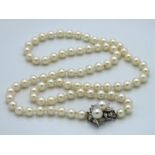 A pearl necklace with 18ct white gold clasp set wi