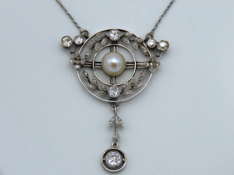 A c.1900 'Belle Époque' platinum pendant & chain set with diamond & pearl, approx. 0.8ct diamonds, 4