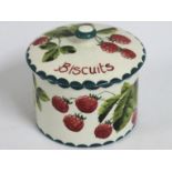 A Wemyss signed biscuit jar with lid, faint hairli