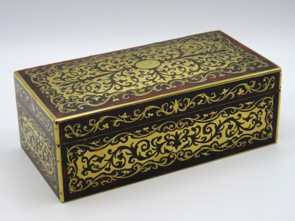 A 19thC. brass inlaid tortoiseshell Boulle work box, inscribed 'Bel' to centre top, 190mm wide x 95m