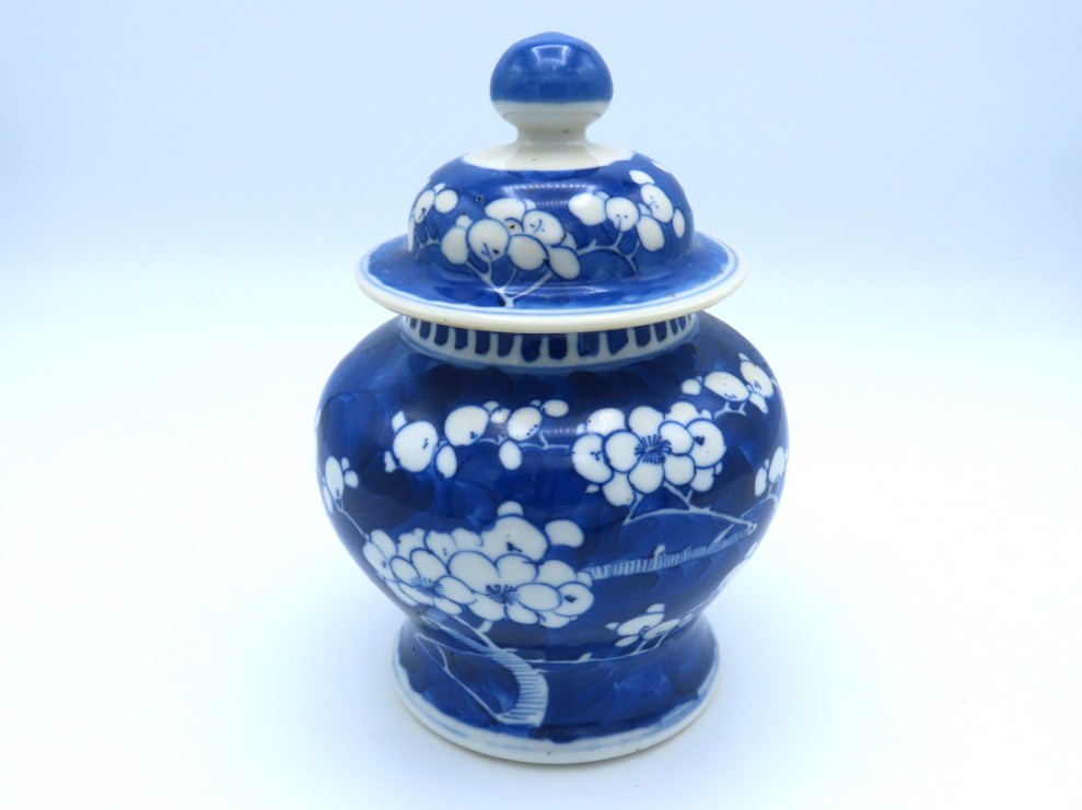 A Chinese ginger jar with prunus decor, four chara