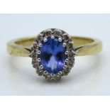 A 9ct gold ring set with tanzanite & diamond of ap