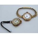 A ladies 9ct gold cased wristwatch with plated str