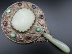 An antique Chinese jade & silver on copper mounted mirror with belt hook handle set with semi precio