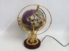 An electric mineral globe, rotates & glows, top ri