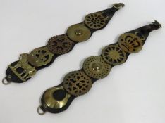 A pair of leathers with antique horse brasses