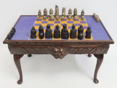 A low level oak topped green man games table conta