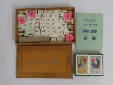 A cased bone & bamboo Chinese Mahjong set
