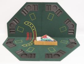 A folding octagonal felt topped black & poker tabl