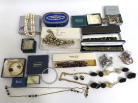 A selection of vintage costume jewellery items whi