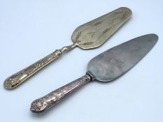 An English silver handled cake slice twinned with