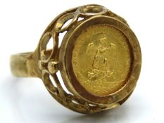 A 9ct gold ring set with a 22ct gold 1945 Dos Peso