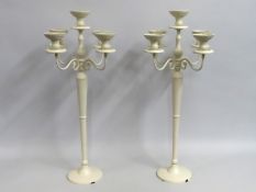 Seven large cream coloured matching wedding candelabra (a pair shown), some signs of usage, 795mm ta