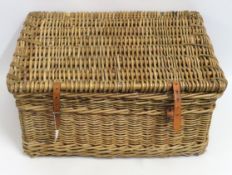 A large wicker basket, 760mm wide x 550mm deep x 3