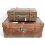 An antique heavy leather travellers suitcase, 860m