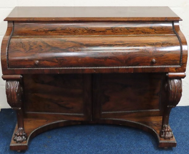 A 19thC. rosewood writing desk with drawers & cupb