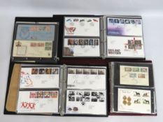 Four first day cover albums, approx. 253 covers in