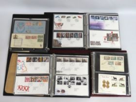Four first day cover albums, approx. 253 covers in