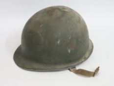 A WW2 US military helmet with lining