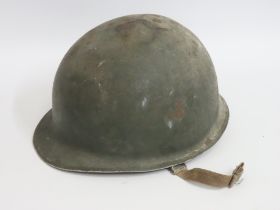 A WW2 US military helmet with lining