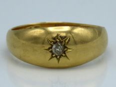 An 18ct gold Romany style ring set with small diam