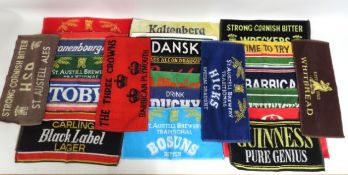 A collection of twenty four beer towels including