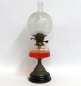 An antique oil lamp with etched shade, 594mm tall