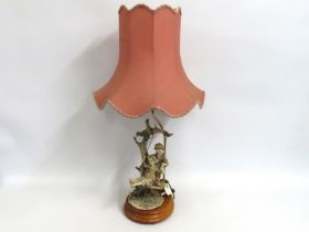 A signed Capodimonte figurative porcelain lamp wit