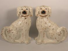 A pair of Victorian Staffordshire pottery spaniels