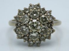 An 18ct white gold diamond cluster ring of approx.