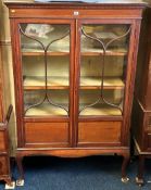 A 19thC. mahogany display cabinet with glazed door