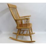 A beech rocking chair, approx. 1110mm high to back