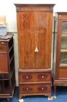 A slimline 19thC. mahogany cupboard with drawers u