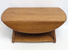 An Ercol 'Golden Dawn' drop leaf coffee table with