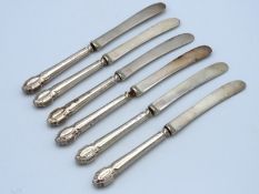 A set of six 1923 Sheffield Henry Wilkinson silver handles fruit knives, rubbed marks