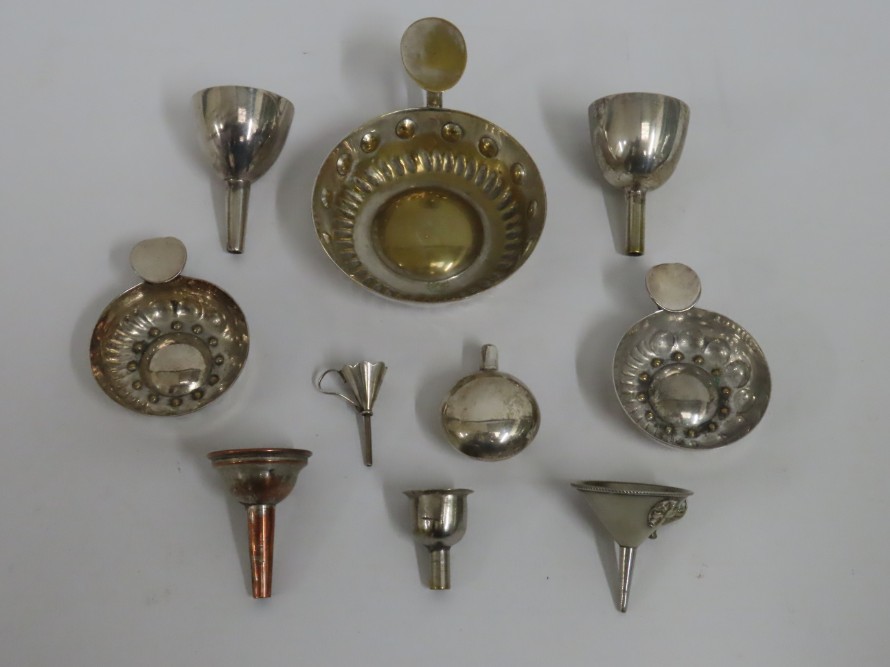 A silver scent bottle twinned with a quantity of plated ware including tastevins & small funnels