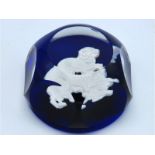 A Baccarat faceted glass paperweight with lion dec