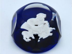 A Baccarat faceted glass paperweight with lion dec