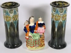 A pair of art nouveau Doulton style pottery vases