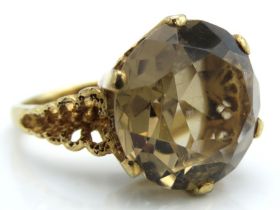 A 9ct gold ring set with smokey quartz, 7.6g, size