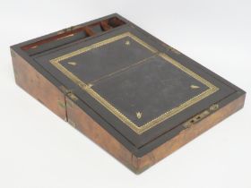 A 19thC. burr walnut writing slope, some faults, c