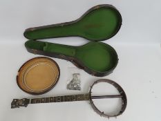 A cased 'The Whirlie' banjo, 805mm long, a/f