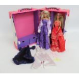 A Barbie set with case, clothes & two figures