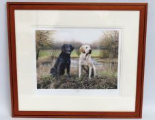 A framed limited edition print of two Labrador dog