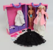 A Barbie set with case, clothes & two figures