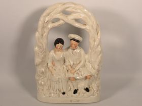 A Victorian Staffordshire pottery wedding group, b