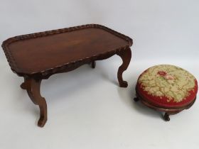 An antique mahogany bed tray with fold out legs, 6