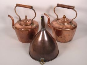 Two Georgian copper kettles twinned with a Georgia